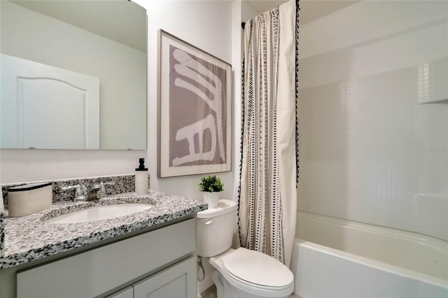 full bathroom featuring toilet, shower / tub combo, and vanity