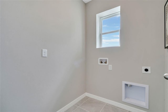 laundry area with hookup for a washing machine, light tile patterned floors, and hookup for an electric dryer