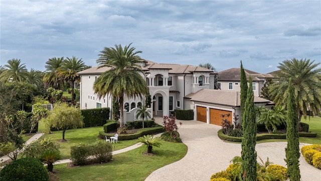 view of front of house with a front yard and a garage