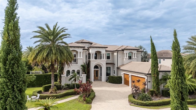 mediterranean / spanish-style home featuring a garage