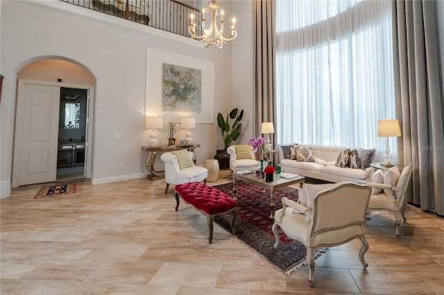 living room featuring a notable chandelier