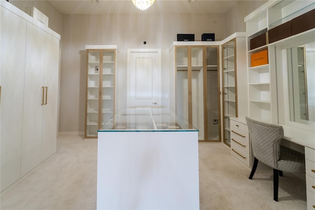 walk in closet featuring light carpet