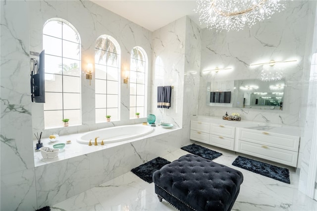 bathroom with a relaxing tiled tub and vanity