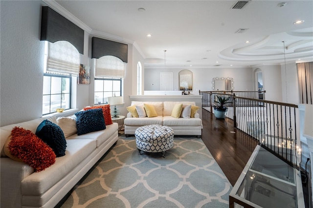 living room featuring dark hardwood / wood-style floors and ornamental molding