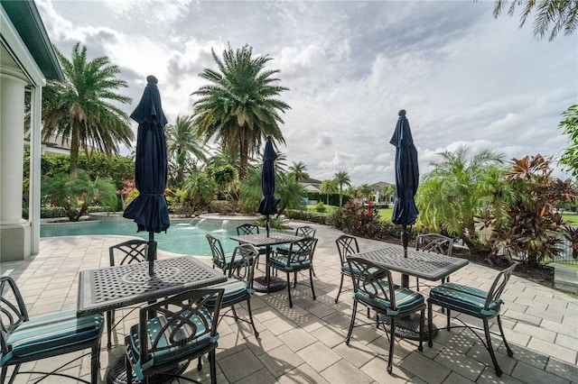 view of patio with pool water feature