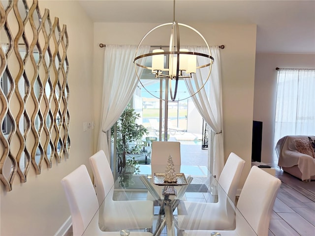 dining area featuring a chandelier