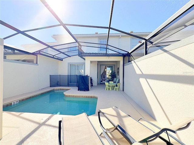 view of pool featuring a lanai and a patio