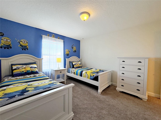 carpeted bedroom with a textured ceiling