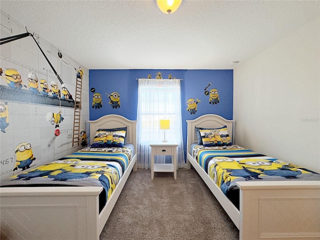 bedroom featuring carpet floors and a textured ceiling