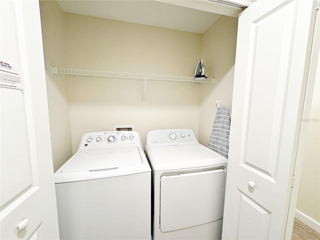 laundry area with washing machine and clothes dryer