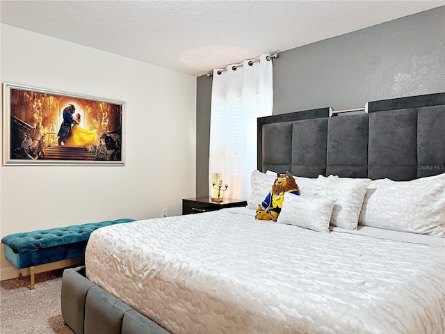 carpeted bedroom featuring a textured ceiling