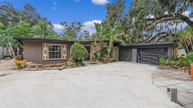 ranch-style home featuring a garage