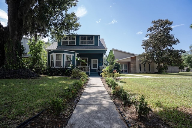 view of front facade with covered porch and a front lawn