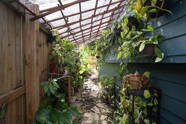 view of property exterior with a pergola