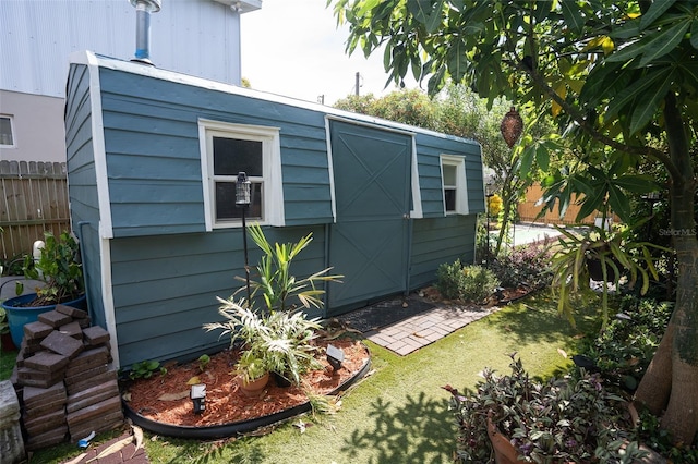 view of outdoor structure with a lawn