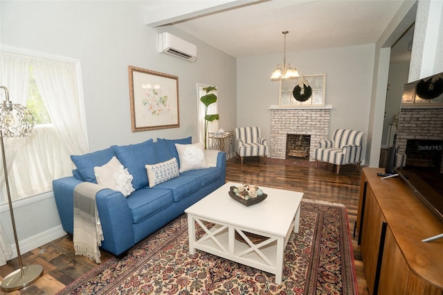 living room with an AC wall unit, a chandelier, dark wood-type flooring, and a brick fireplace