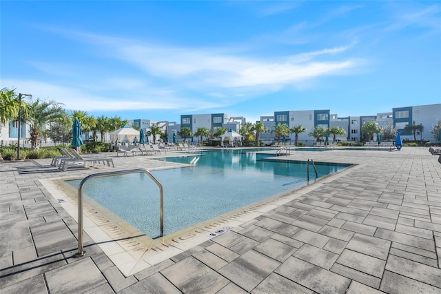 view of swimming pool with a patio area