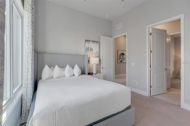 bedroom with light colored carpet