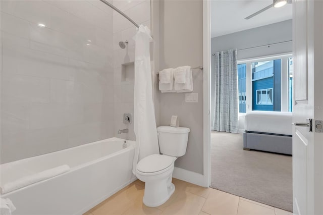 bathroom with tile patterned flooring, shower / bath combination with curtain, toilet, and ceiling fan