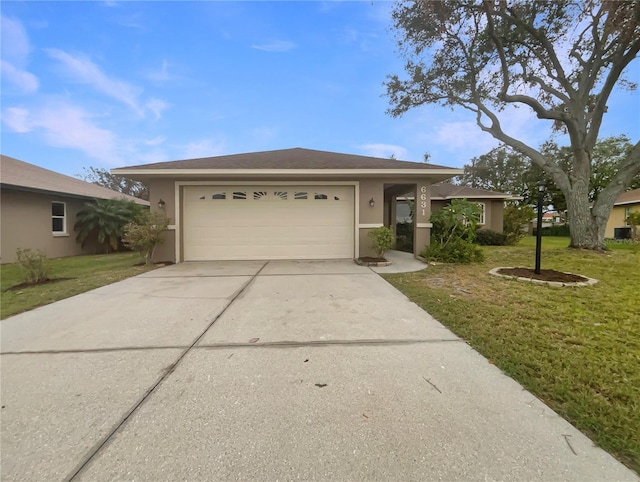 view of front of home featuring a garage and a front yard