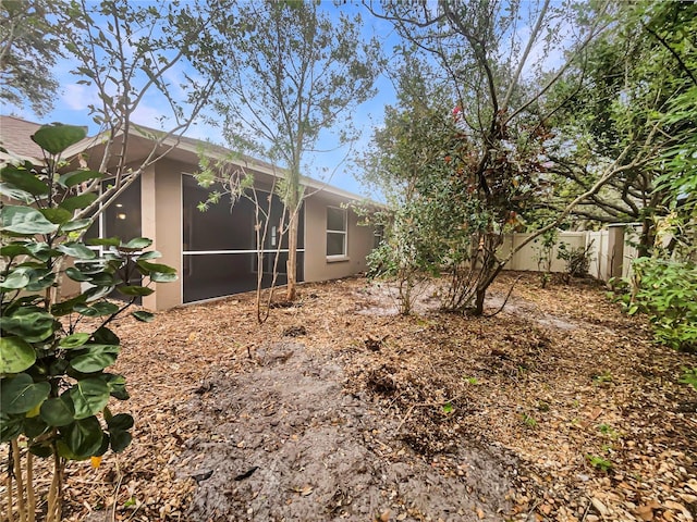 view of yard featuring a sunroom