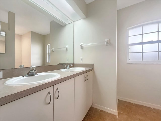 bathroom featuring tile patterned flooring and vanity