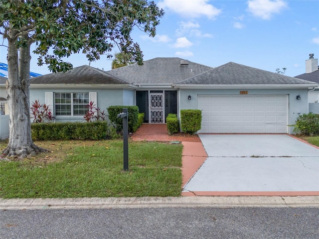 single story home with a garage and a front yard