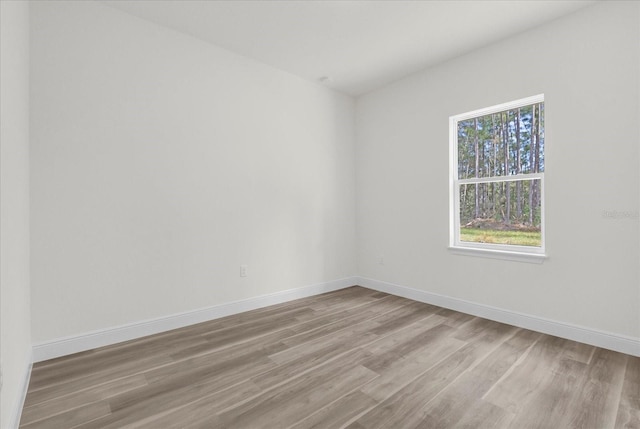 unfurnished room featuring light wood-type flooring