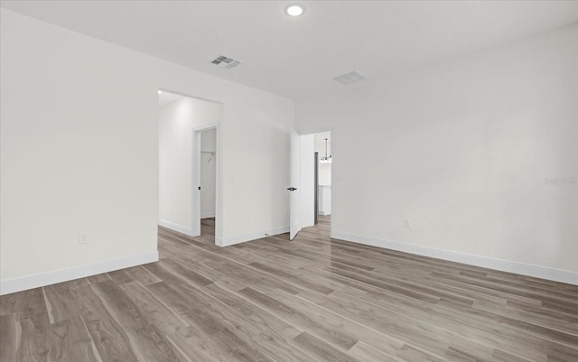 15123 SW 61st Court Rd, Ocala, FL 34473 - empty room featuring light wood-style floors, baseboards, and recessed lighting
