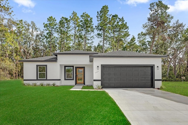 view of front of property featuring an attached garage, stucco siding, driveway, and a front yard