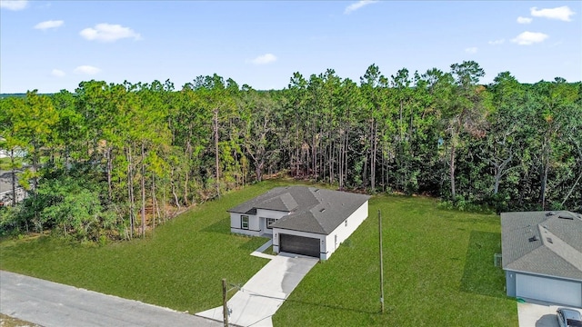 drone / aerial view with a view of trees