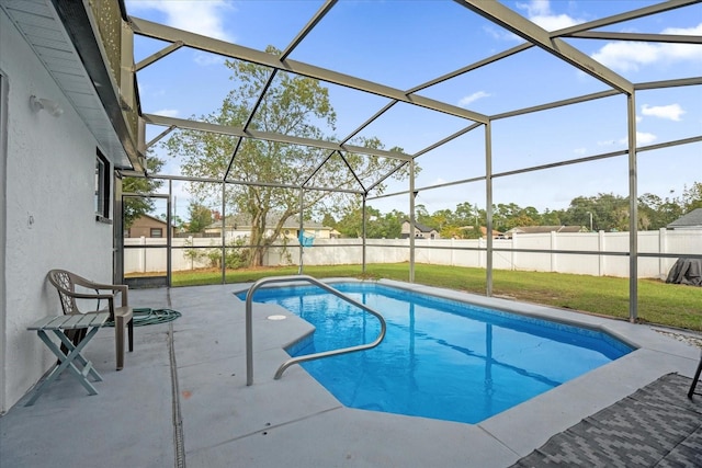 view of pool featuring a lawn, a lanai, and a patio area