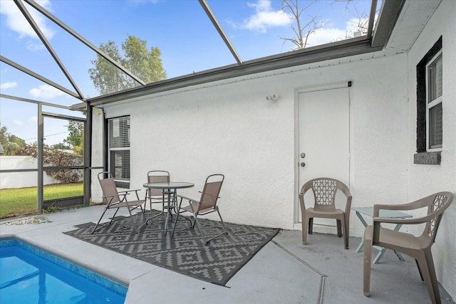 sunroom with a swimming pool and plenty of natural light