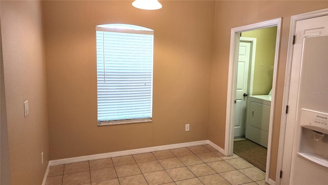 washroom featuring light tile patterned floors and washer / dryer