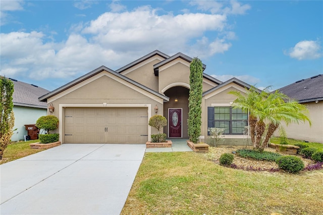 view of front of property with a garage and a front yard