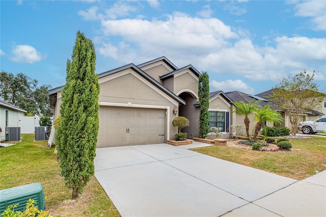 view of front of house featuring a garage, central AC, and a front yard