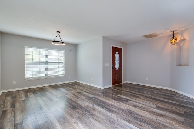 foyer entrance with dark hardwood / wood-style floors