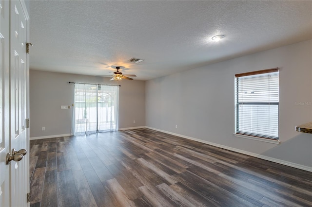 unfurnished room with ceiling fan, a textured ceiling, and dark hardwood / wood-style flooring