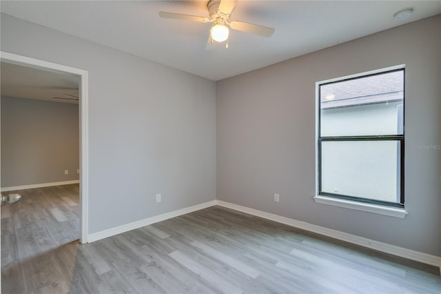 spare room with ceiling fan and light hardwood / wood-style floors