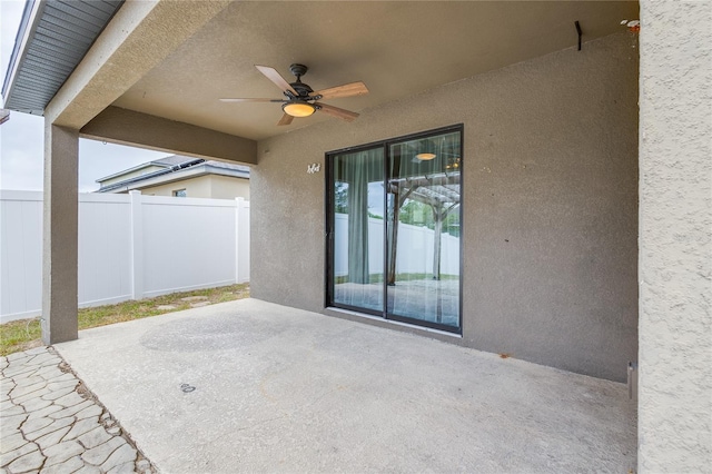 view of patio featuring ceiling fan