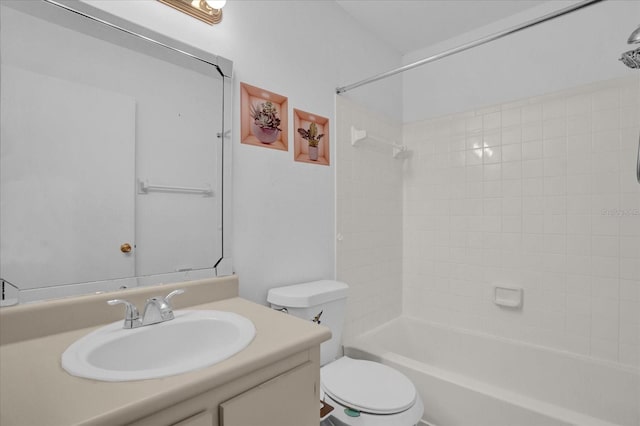 full bathroom featuring vanity, toilet, and tiled shower / bath