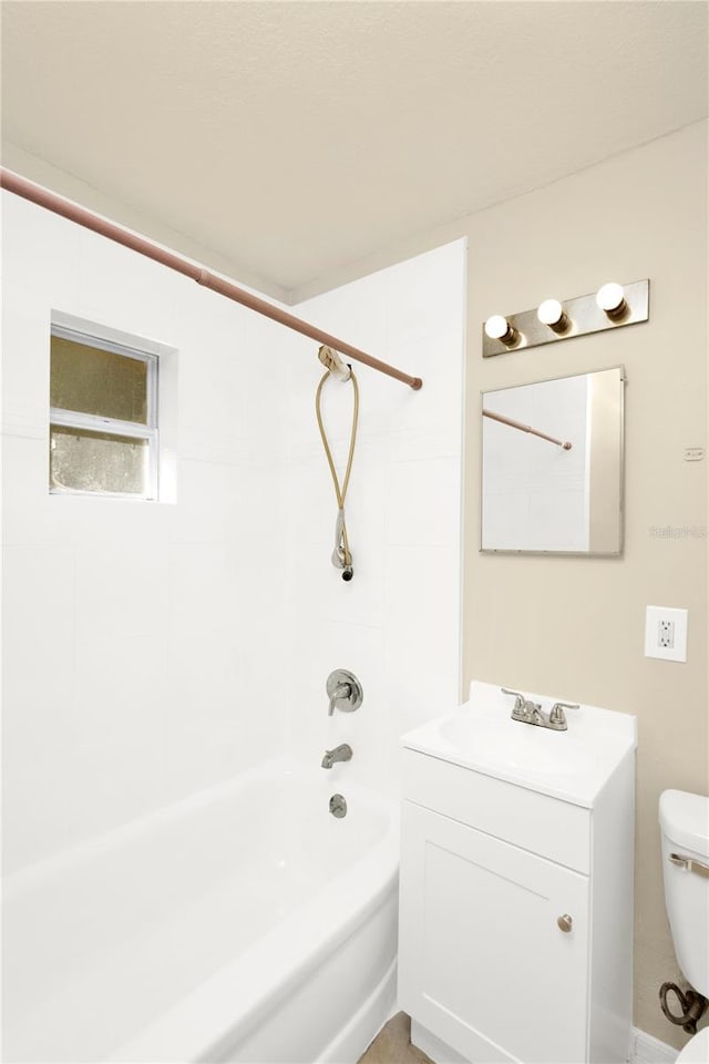 full bathroom with vanity, toilet, and tiled shower / bath