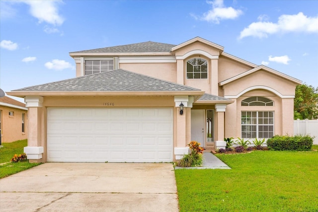 14646 Brightwell Ct, Orlando, FL 32824 - traditional home with a front lawn, concrete driveway, stucco siding, and roof with shingles