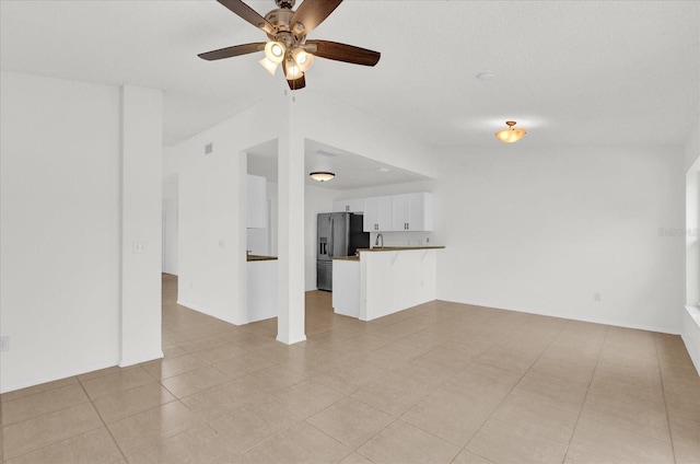 14646 Brightwell Ct, Orlando, FL 32824 - unfurnished living room featuring ceiling fan and light tile patterned floors