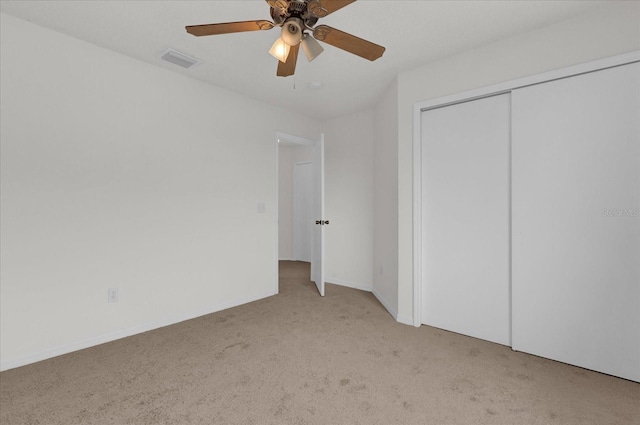 14646 Brightwell Ct, Orlando, FL 32824 - unfurnished bedroom featuring carpet flooring, a ceiling fan, and a closet