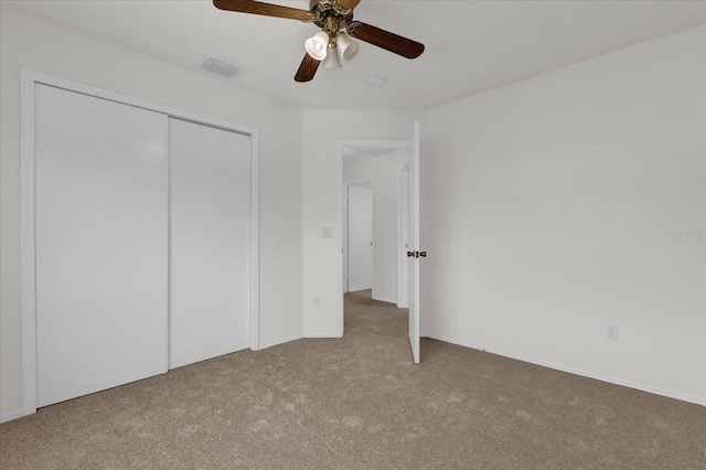14646 Brightwell Ct, Orlando, FL 32824 - unfurnished bedroom featuring carpet floors, a closet, and ceiling fan