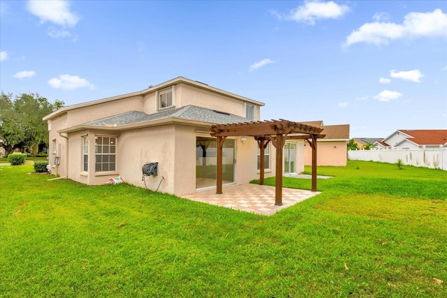 back of property featuring a patio area, a lawn, and a pergola