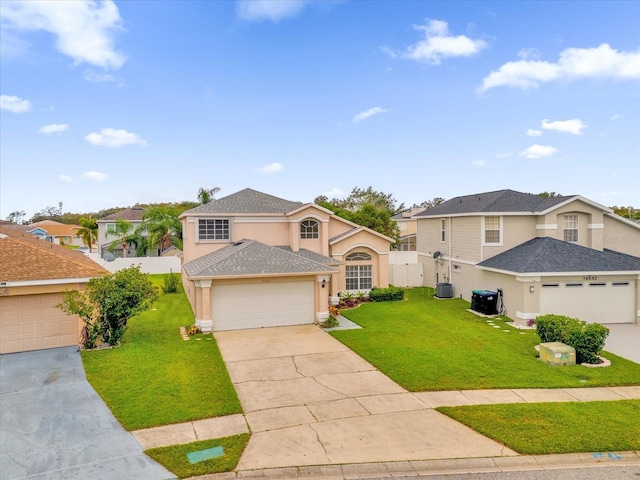 14646 Brightwell Ct, Orlando, FL 32824 - traditional home with stucco siding, a residential view, concrete driveway, and central AC
