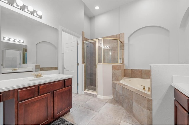 bathroom featuring vanity, tile patterned floors, and independent shower and bath