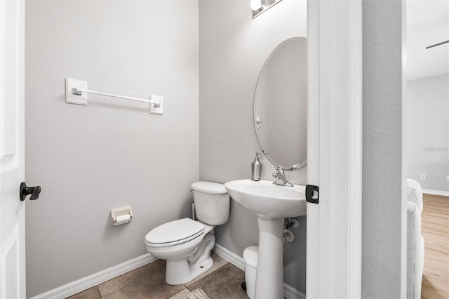 bathroom featuring tile patterned floors and toilet